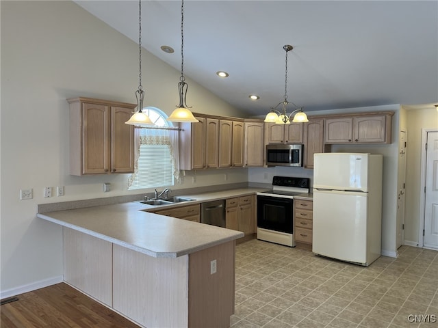 kitchen featuring hanging light fixtures, vaulted ceiling, stainless steel appliances, and sink