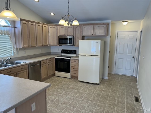 kitchen featuring appliances with stainless steel finishes, decorative light fixtures, lofted ceiling, sink, and light brown cabinets