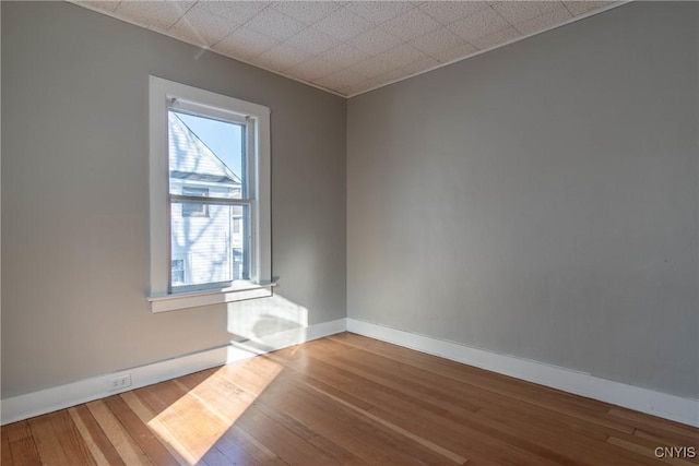 empty room featuring hardwood / wood-style floors