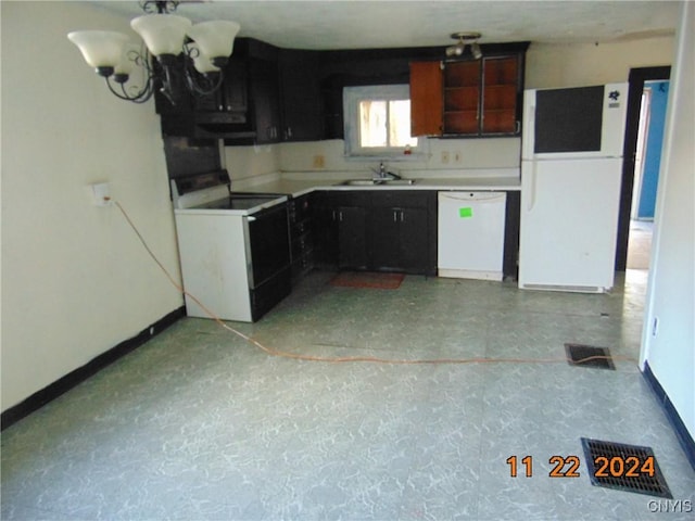 kitchen with sink and white appliances