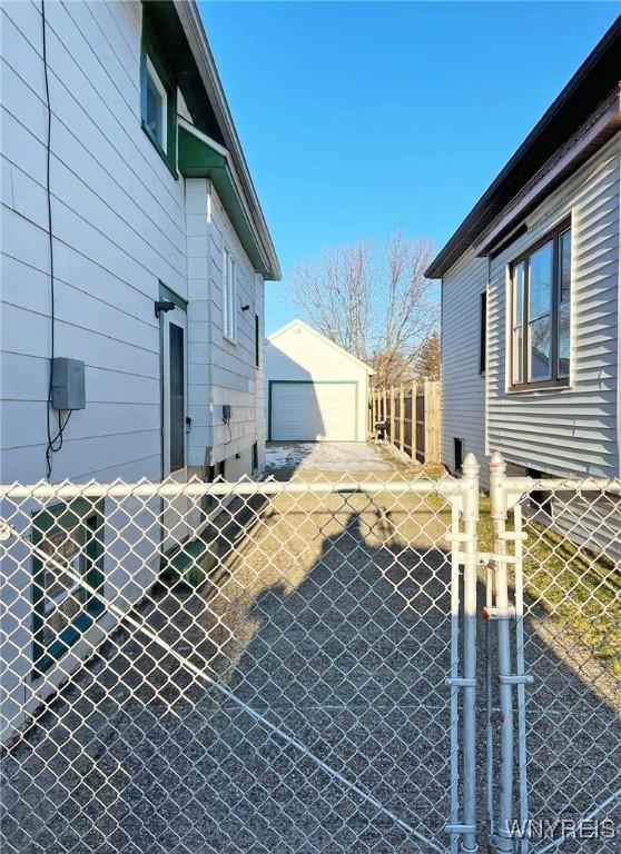 view of side of home with an outbuilding and a garage