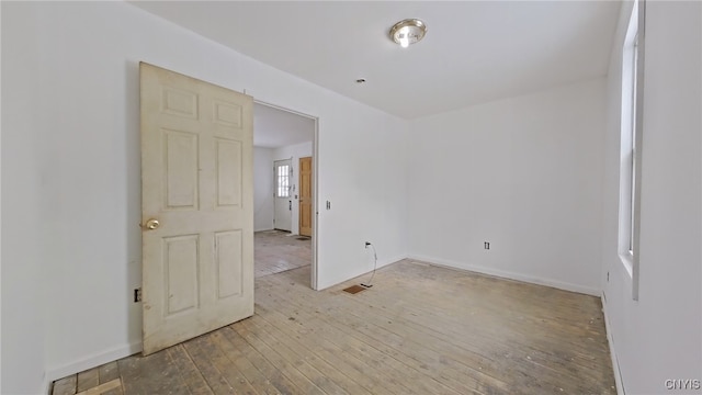 spare room with light wood-type flooring