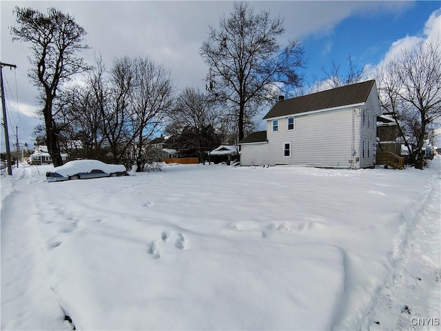 view of yard layered in snow