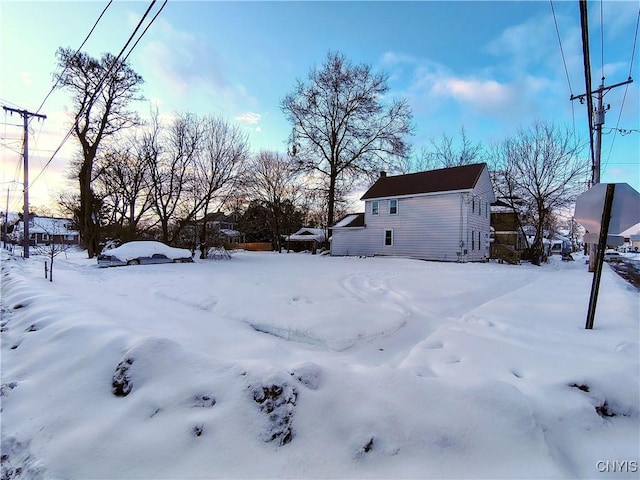 view of yard layered in snow