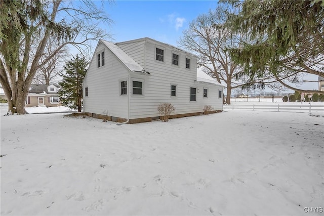 view of snow covered house