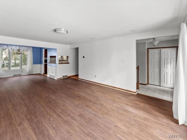 unfurnished room with light hardwood / wood-style flooring