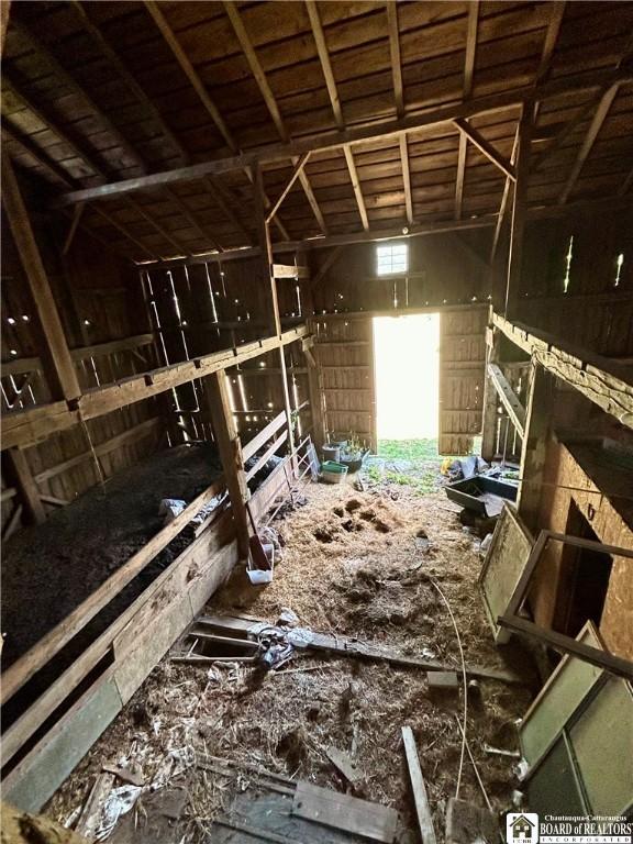 miscellaneous room featuring lofted ceiling