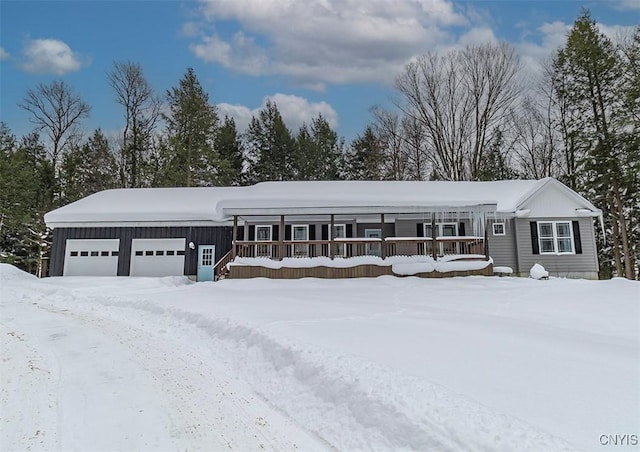 view of front of property featuring a garage and a porch