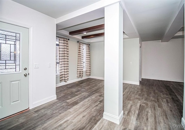 foyer with dark wood-type flooring and beam ceiling