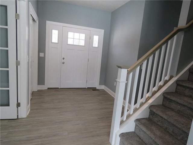 entrance foyer with light hardwood / wood-style floors