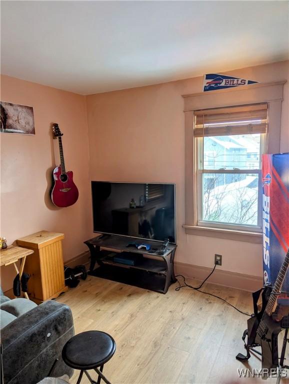 living room with wood finished floors and baseboards