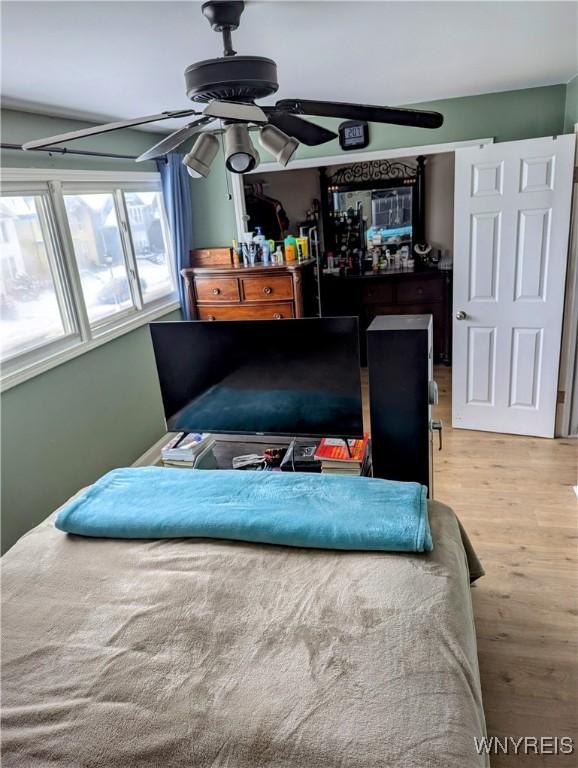 bedroom with wood finished floors