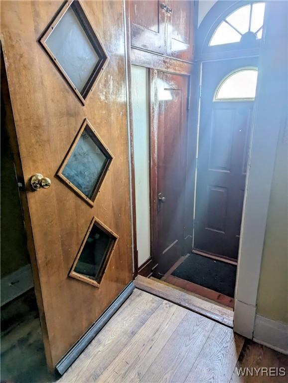 foyer entrance featuring wood-type flooring