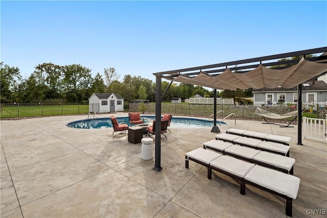 view of swimming pool with an outbuilding, a pergola, and a patio area