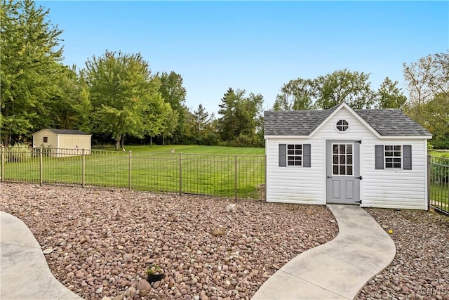 view of outbuilding with a yard