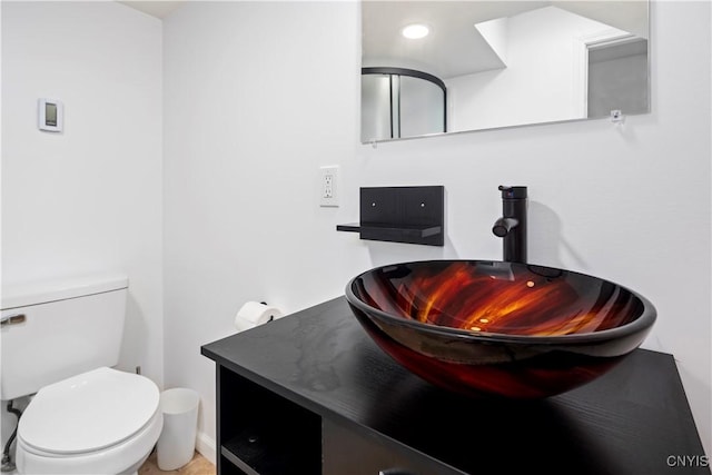 bathroom with vanity and toilet