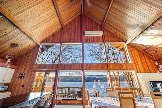 11995 E Lake Rd, Wayne, NY 14840 - living room featuring a water view, high vaulted ceiling, track lighting, wood ceiling with exposed beams, and wood walls