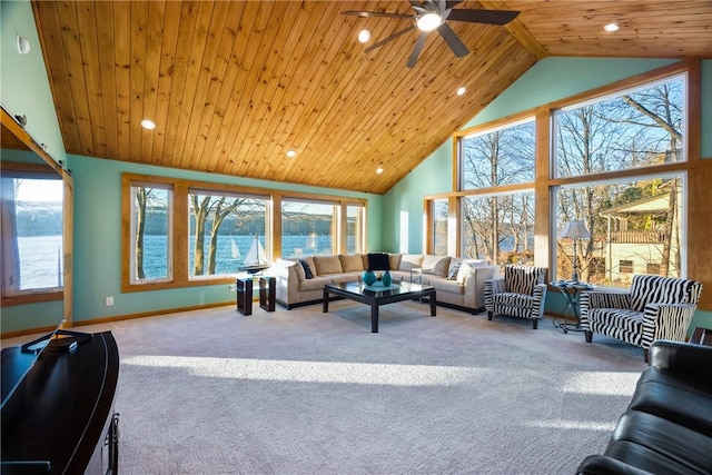 carpeted living room with wood ceiling, high vaulted ceiling, ceiling fan, and a water view