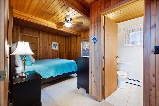 tiled bedroom featuring beam ceiling, wooden walls, ceiling fan, and baseboard heating