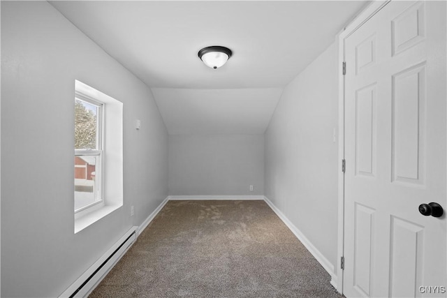 bonus room featuring a baseboard radiator, carpet, plenty of natural light, and vaulted ceiling