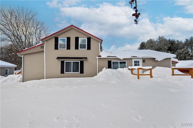 view of snow covered house