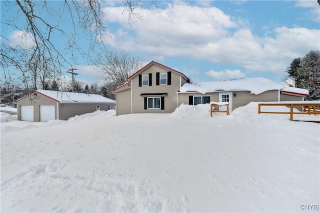 snow covered property featuring a garage