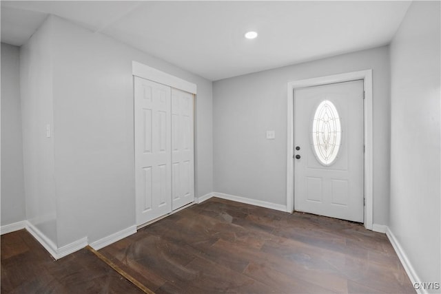 entryway with dark hardwood / wood-style floors