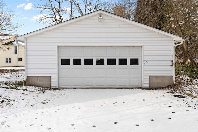 view of snow covered garage