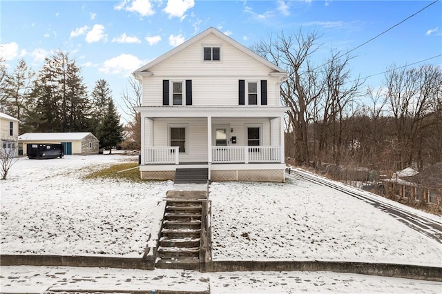 view of front of house with a porch and a storage shed