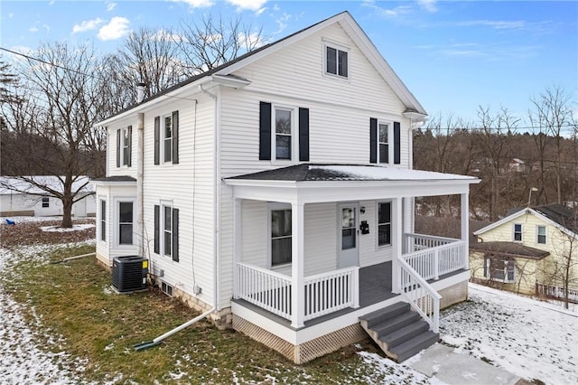 view of front of property featuring cooling unit and covered porch