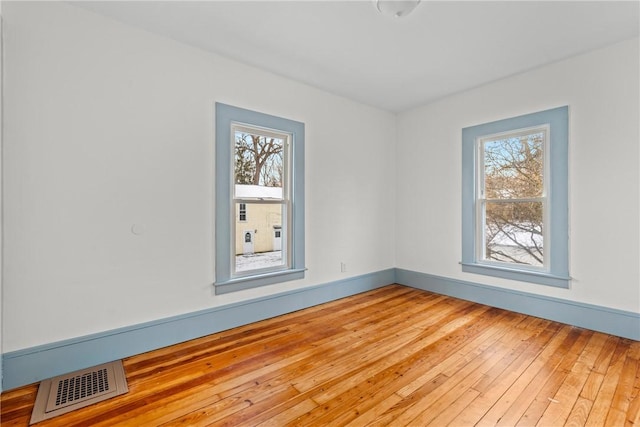 empty room with light wood-type flooring