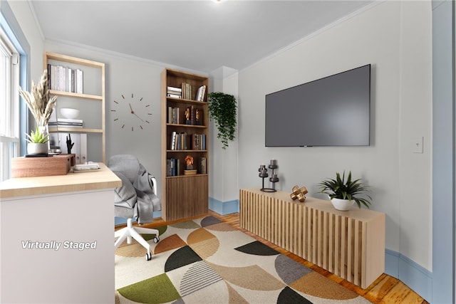 office area featuring crown molding and light hardwood / wood-style flooring