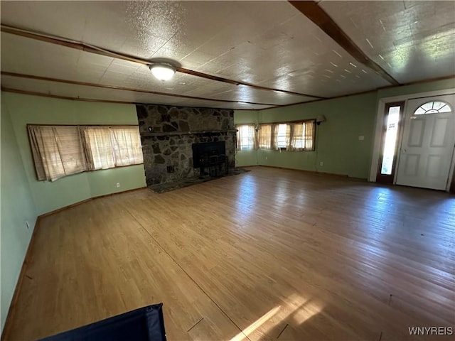 unfurnished living room with hardwood / wood-style flooring