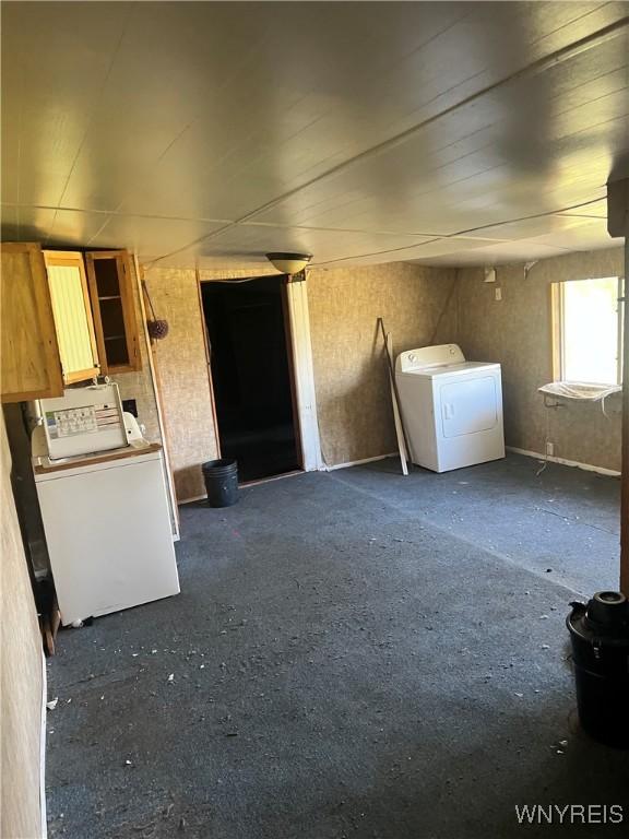 clothes washing area featuring independent washer and dryer