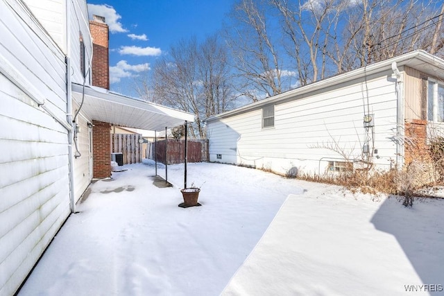 view of yard layered in snow