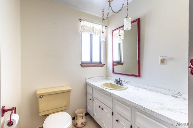 bathroom with vanity and toilet