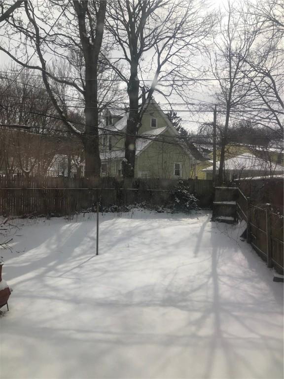 view of yard layered in snow