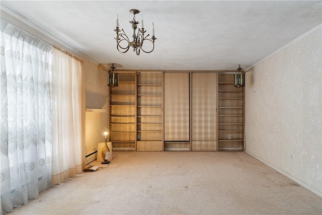 spare room with a chandelier, light colored carpet, and baseboard heating