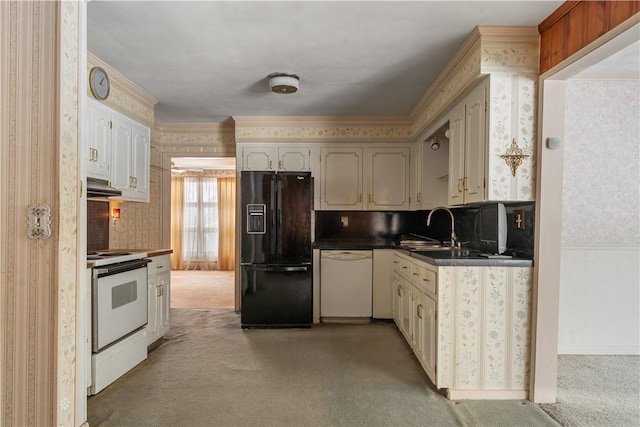 kitchen with tasteful backsplash, sink, white appliances, and light colored carpet