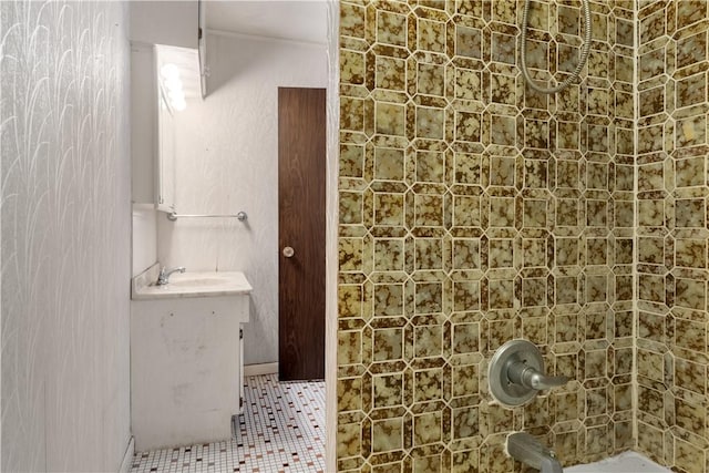 bathroom featuring walk in shower, tile patterned floors, and vanity