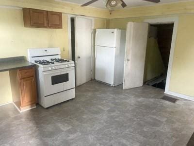 kitchen with ceiling fan and white appliances