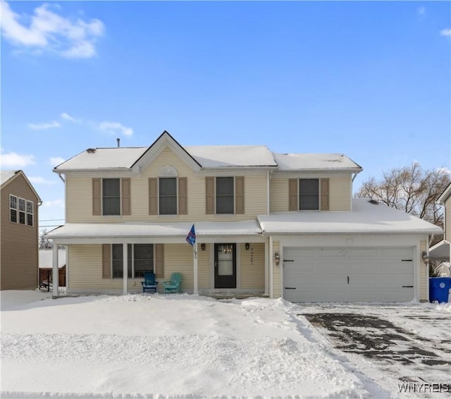 front facade with a garage and covered porch