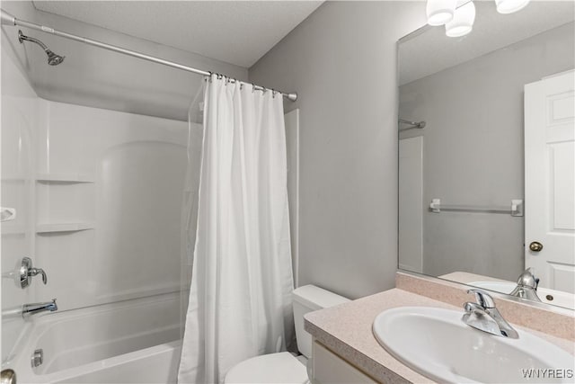 full bathroom featuring shower / bathtub combination with curtain, vanity, toilet, and a textured ceiling