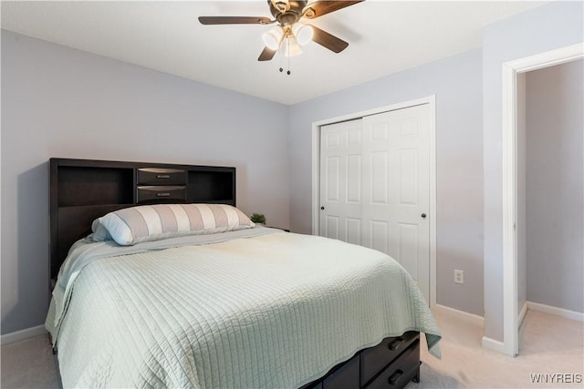 carpeted bedroom featuring a closet and ceiling fan