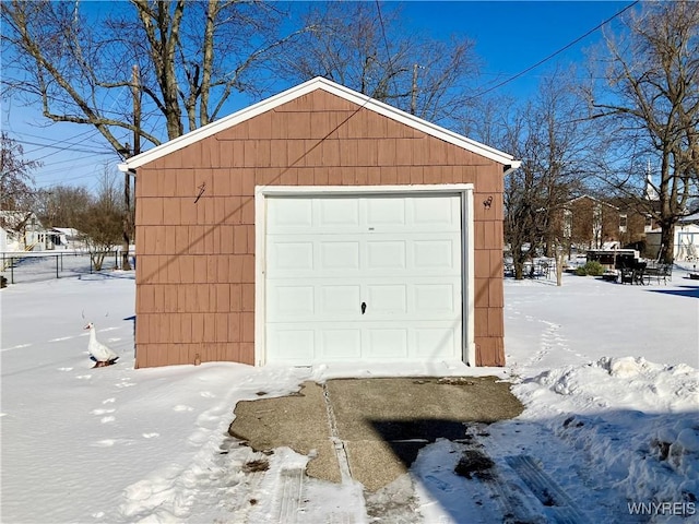 view of snow covered garage