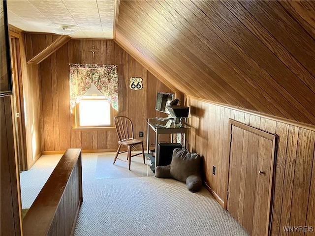 bonus room featuring wood ceiling, light colored carpet, vaulted ceiling, and wood walls