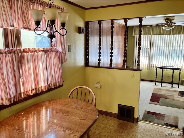 dining room featuring ceiling fan and ornamental molding