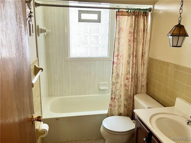 full bathroom featuring vanity, tile walls, shower / bath combo, and toilet