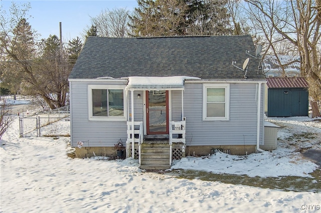 view of front of home with a storage shed