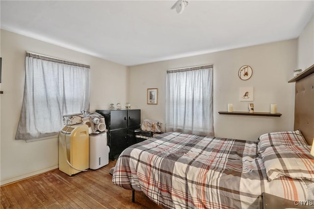 bedroom with hardwood / wood-style flooring